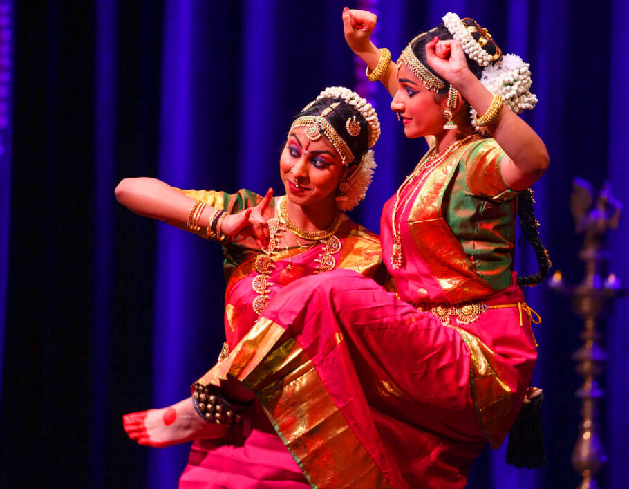 Professional Bharatanatyam dancer in traditional costume with mudra pose